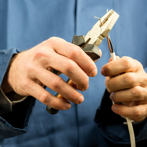 close-up of wires being clipped